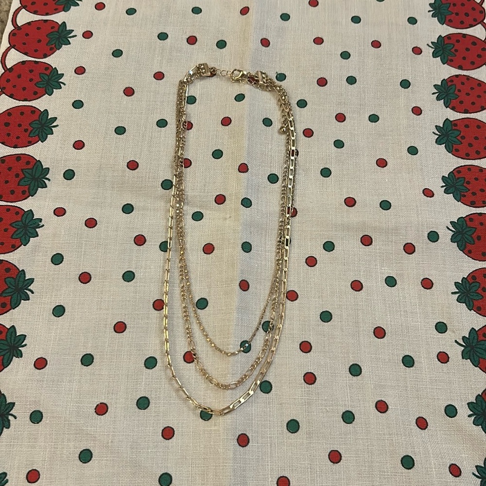 Three chain gold necklace